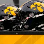 Kahmari Brown Iowa edge rusher pressuring quarterback during game action