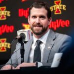 Iowa State coach Jimmy Rogers huddles with his Cyclones players