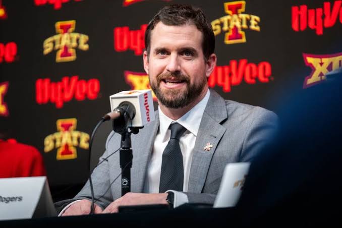 Iowa State coach Jimmy Rogers huddles with his Cyclones players