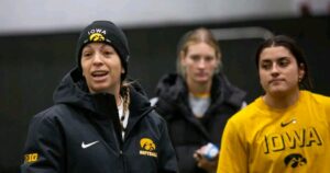 Iowa softball head coach May-Johnson watching Hawkeyes during game