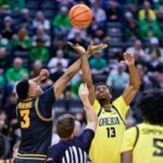 Bennett Stirtz (#3 Iowa) drives against Oregon defenders during the Iowa vs Oregon basketball game.